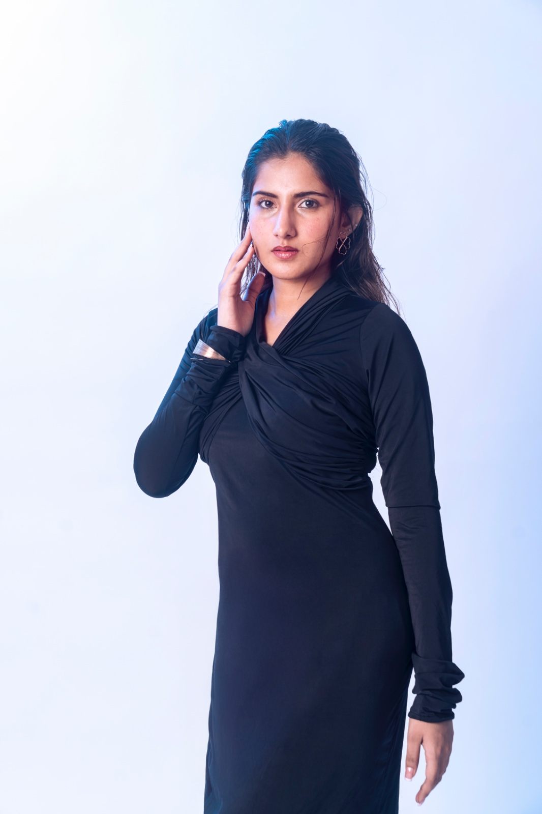 Black tailored vest set, arms crossed